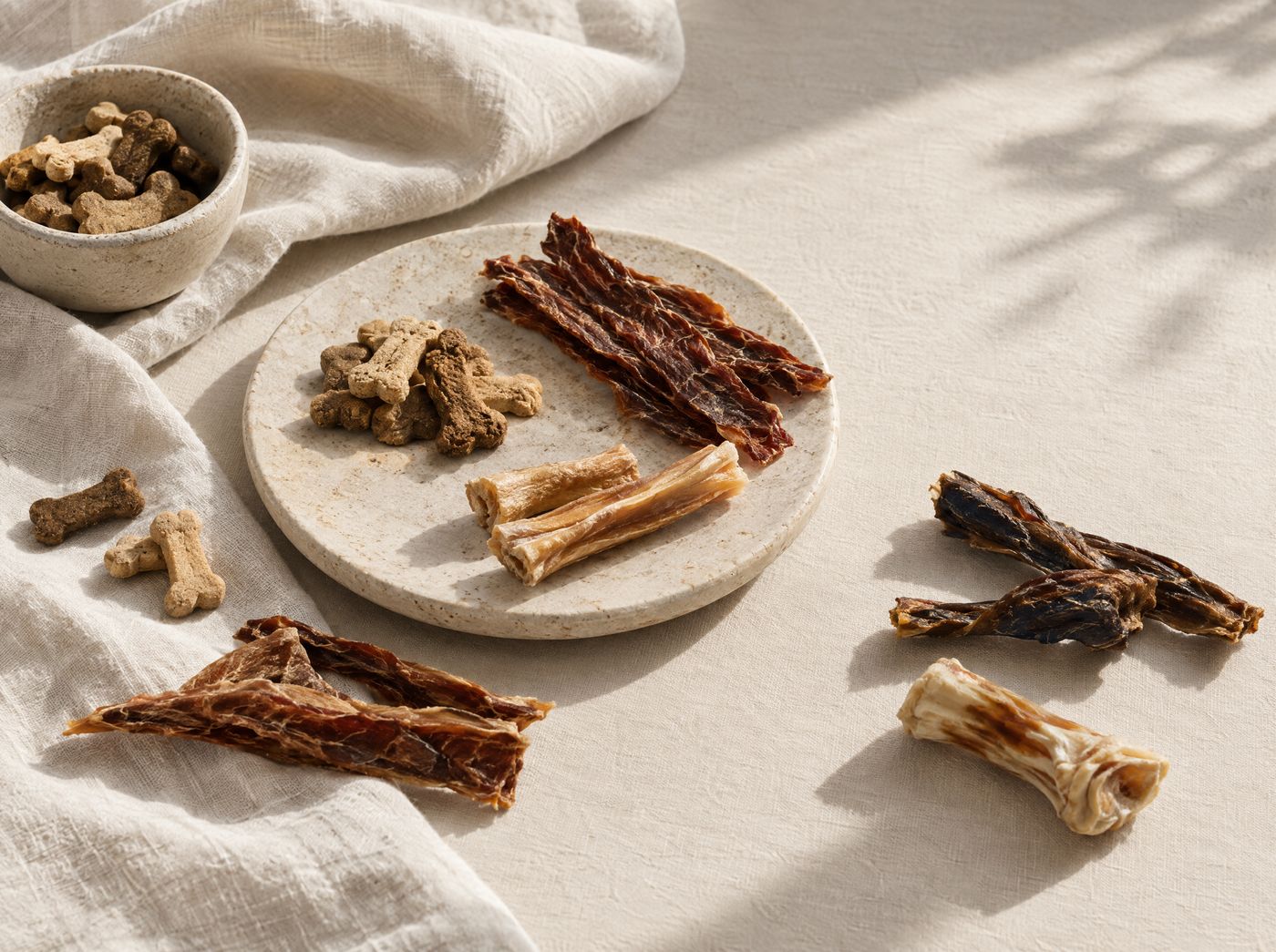 Natural pet treats arranged on linen